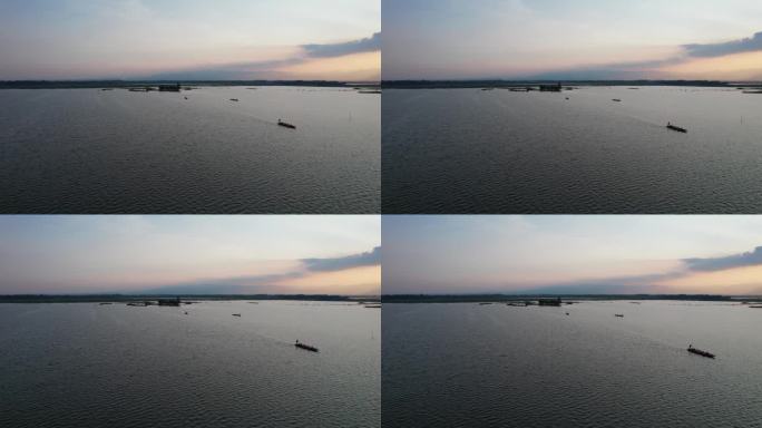 无人机拍摄的日落前帕瑶湖划船的鸟瞰图
