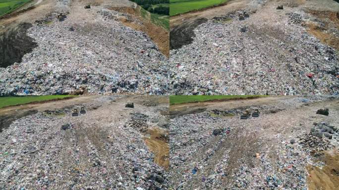 鸟瞰图大型垃圾填埋场、垃圾场。成群的鸟在垃圾堆上空盘旋。生态问题，自然污染。污染和过度消费的观念。
