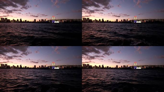 日落时的日本东京彩虹大桥和大海的广角空镜