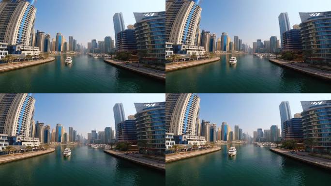 夏天的迪拜运河河上有船和建筑