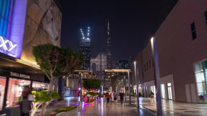 夜间照明迪拜市中心著名的旅游商场街道步行全景4k延时阿联酋