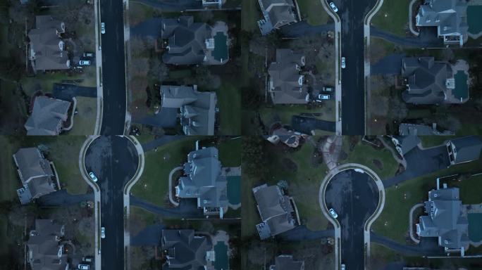 空中俯瞰的豪华美国社区与私人街道和死胡同。美国夜晚黑暗的房子。直下天桥。