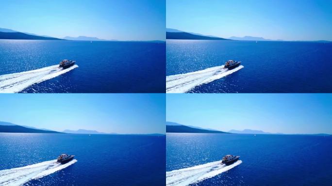 白色游艇在黑山蓝色大海上的鸟瞰图