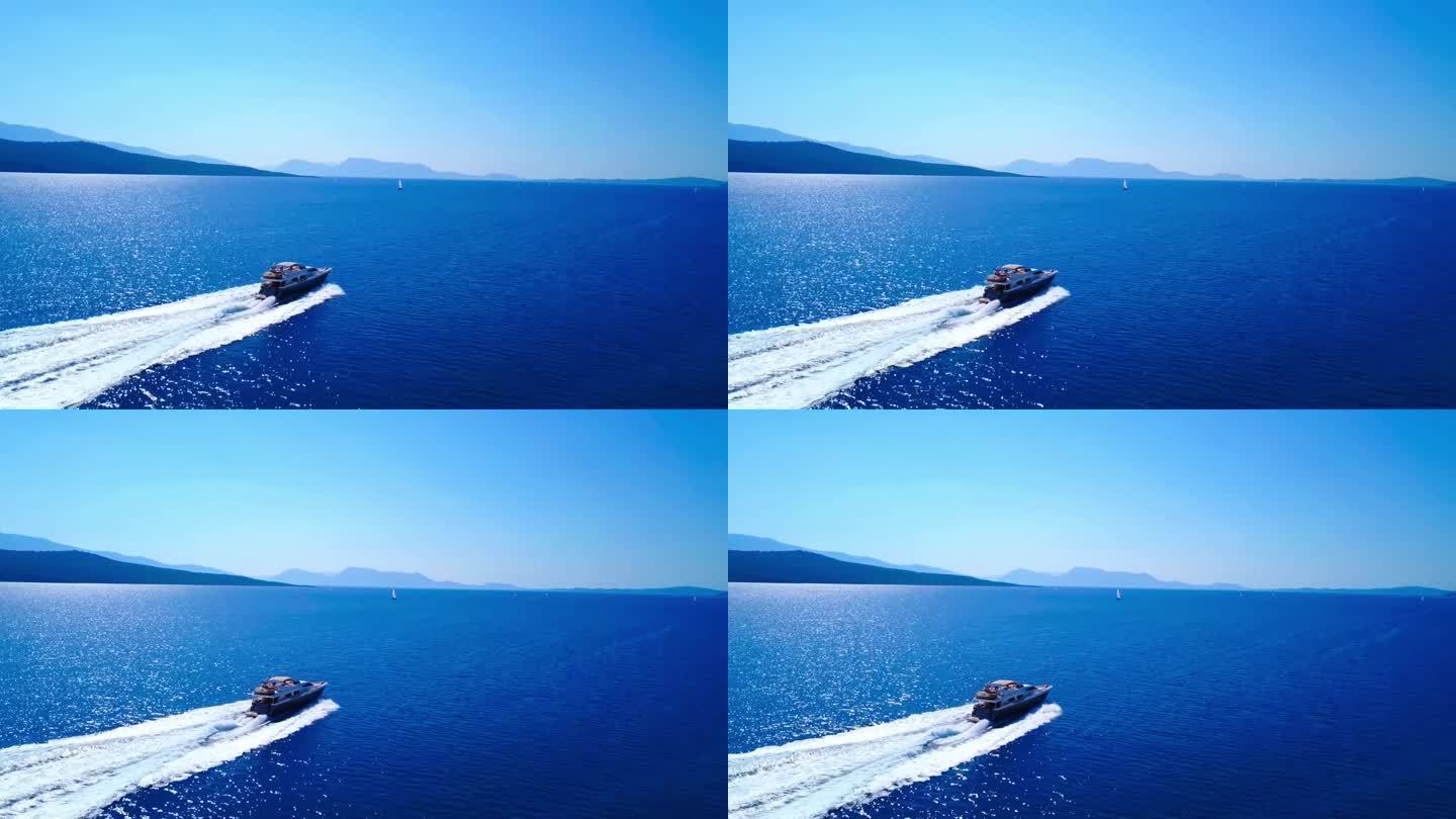白色游艇在黑山蓝色大海上的鸟瞰图