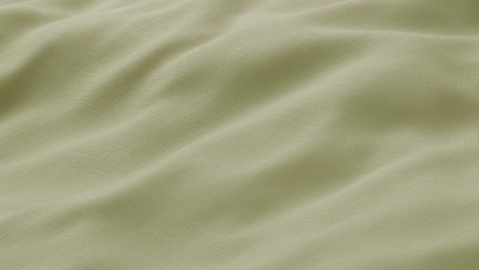 特写波浪绿色丝绸面料飘动表面与织物细节