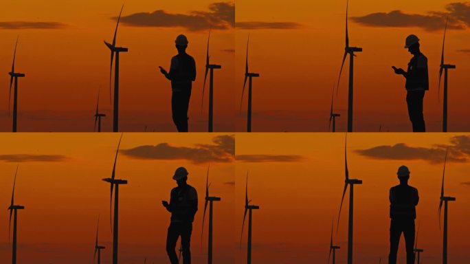 黄昏值班:黄昏时监测风力涡轮机进展的工程师。拥有风力涡轮机的绿色能源农场。