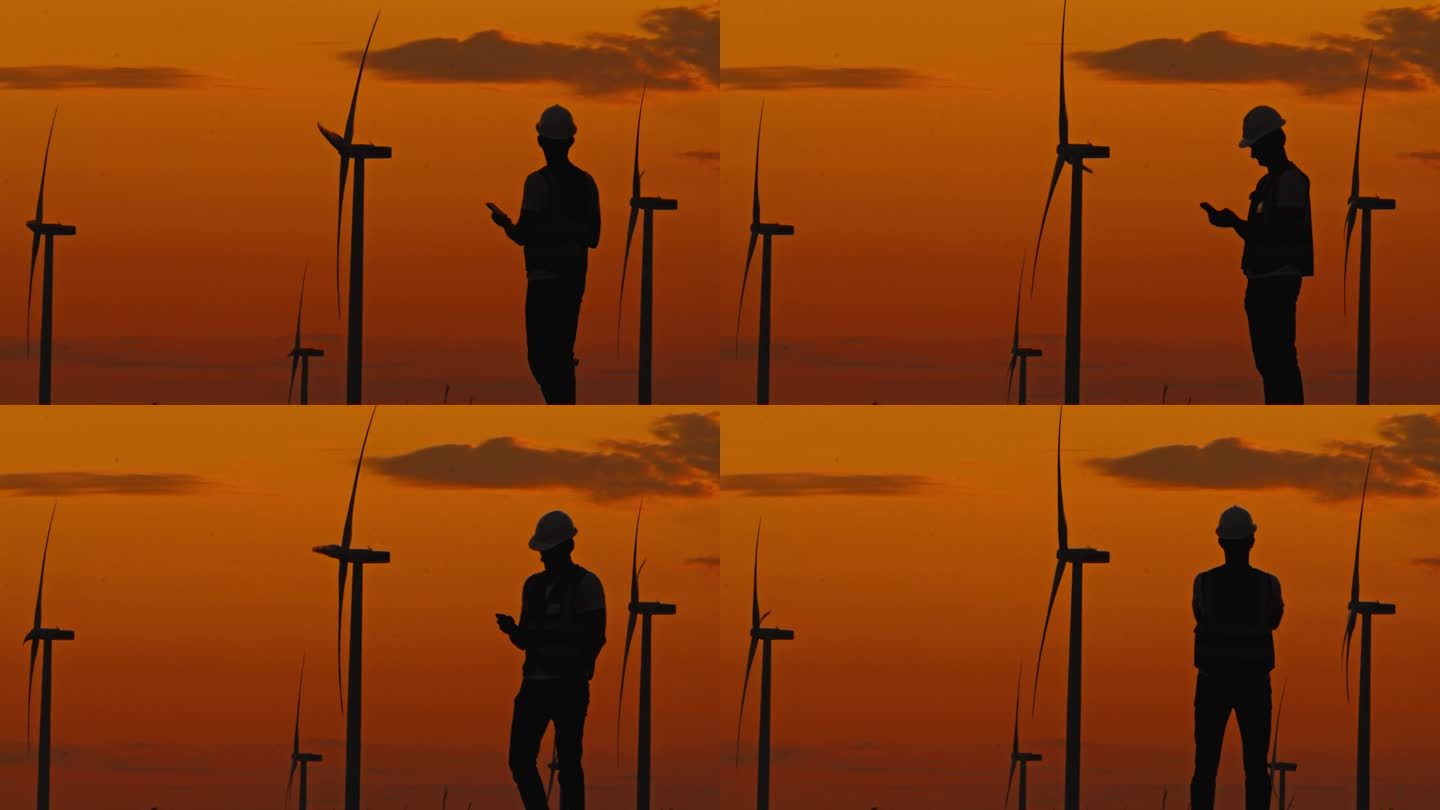 黄昏值班:黄昏时监测风力涡轮机进展的工程师。拥有风力涡轮机的绿色能源农场。