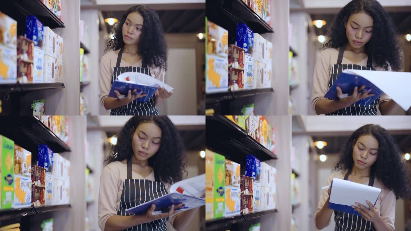 一名年轻女子在超市用条码扫描器清点货架上的商品。