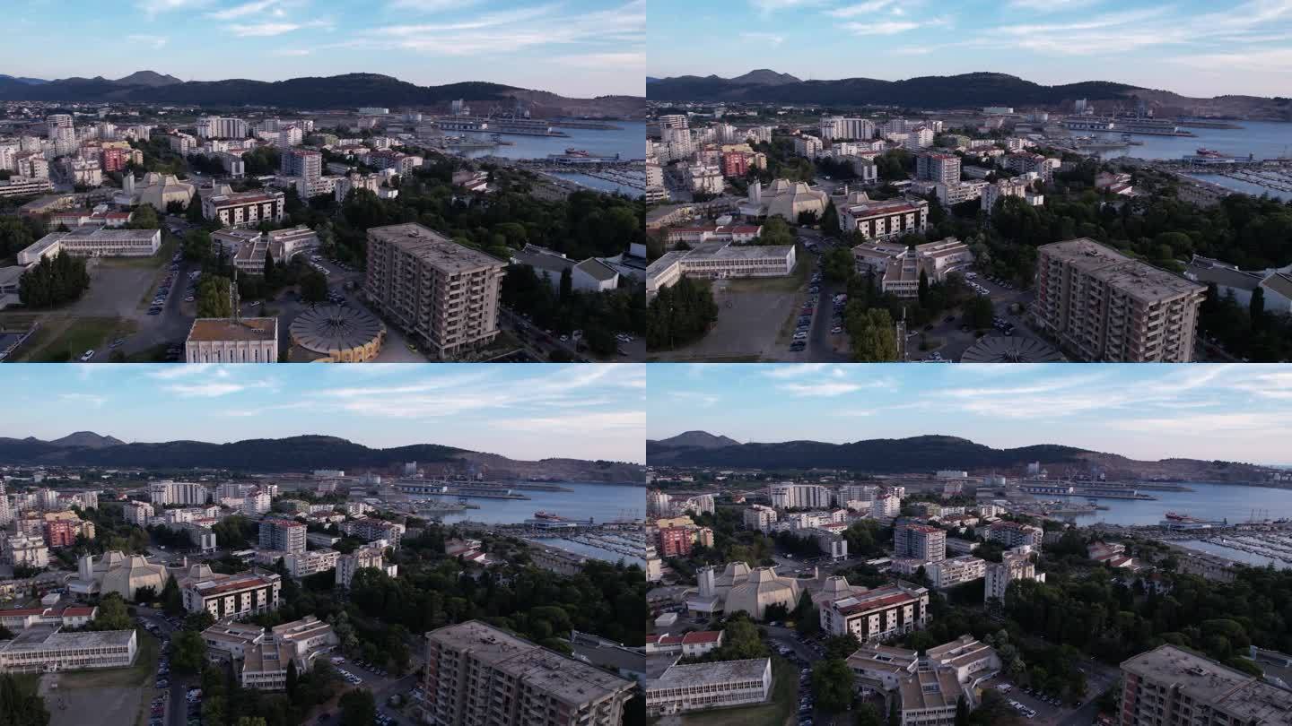 酒吧,黑山。日落后的城市景观，建筑物和港口鸟瞰图，无人机拍摄