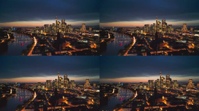 4K鸟瞰图法兰克福的主要天际线的实时镜头，虽然美因河和现代金融大楼和摩天大楼与法兰克福大教堂在日落时