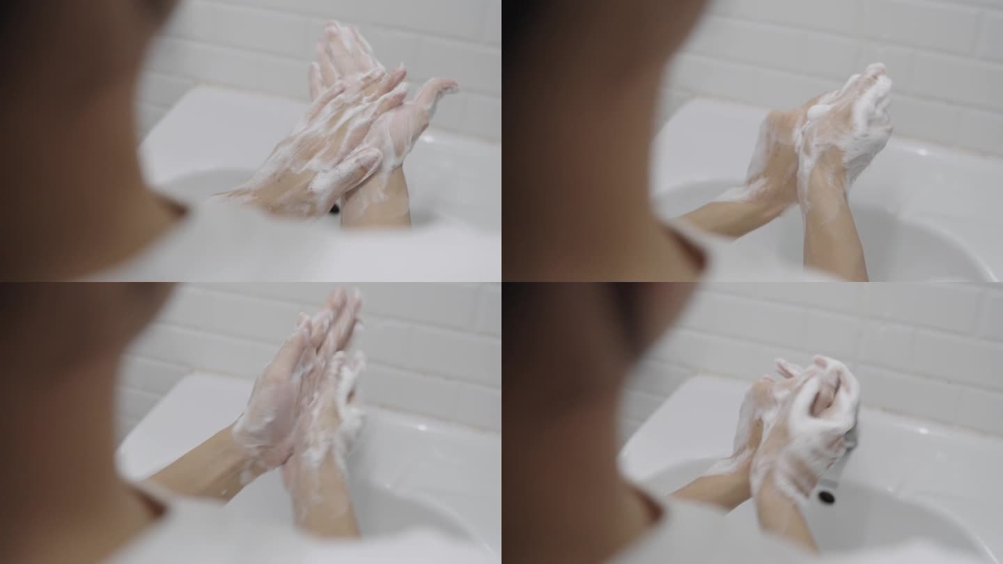 在水槽中用肥皂洗手的特写镜头