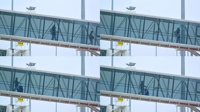 机场玻璃廊桥旅客登机下飞机