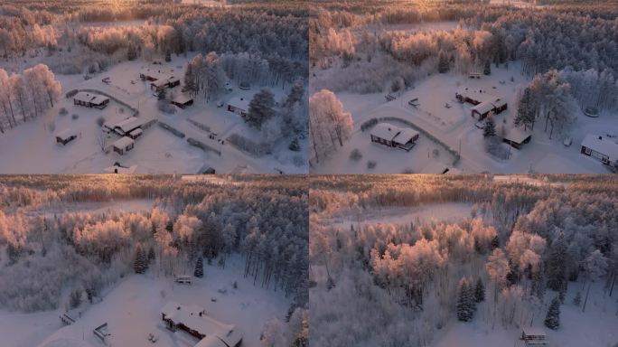 风景飞过视频在小斯堪的纳维亚村庄和冬季森林广泛覆盖白霜和突出的日落。极度寒冷，零下30度。