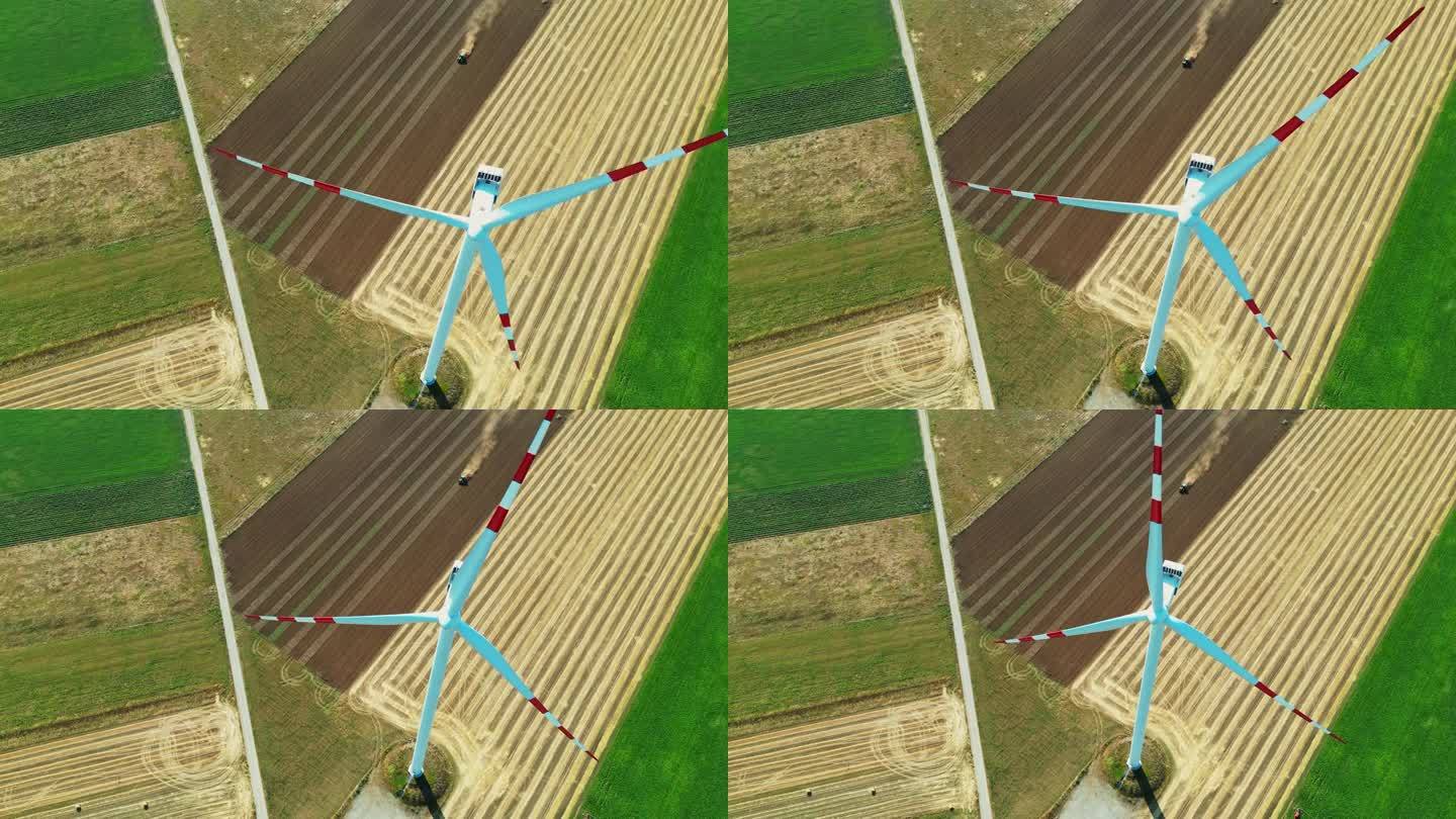 空中收获风:无人机视图旋转涡轮机在农民的田地