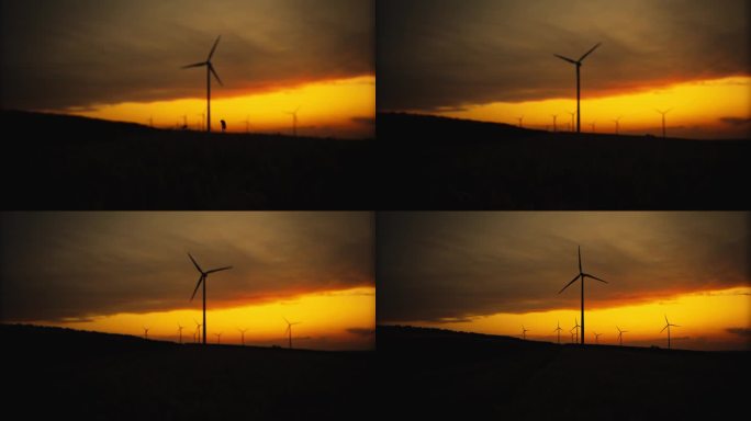 可持续发展的剪影:暴风雨黄昏天空下的风力涡轮机