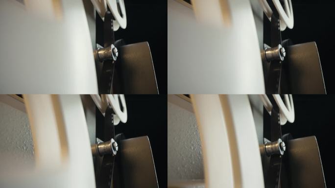 8mm胶片放映机旋转胶片卷轴的宏观工作过程。机制