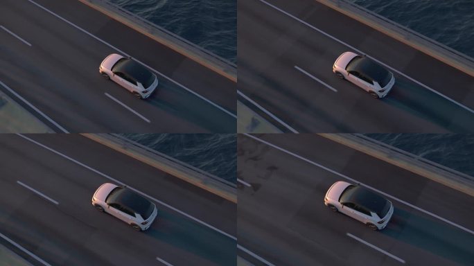 一辆普通电动汽车在桥上或沿海道路上行驶的俯视图