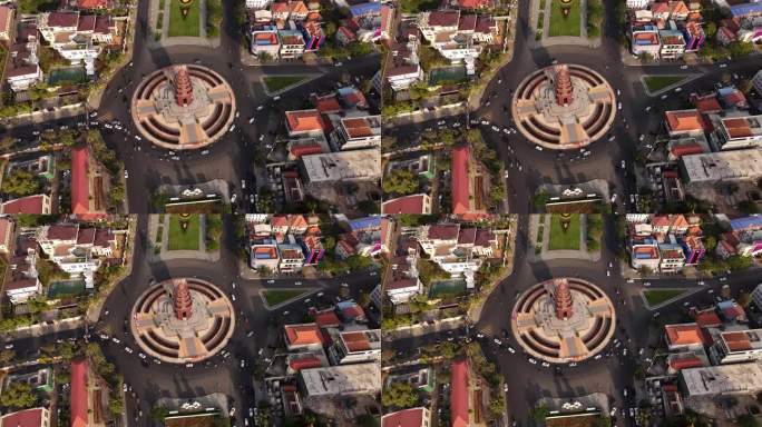 柬埔寨金边市标志性的独立纪念碑上空的无人机镜头。环岛周围的静态录像和交通状况