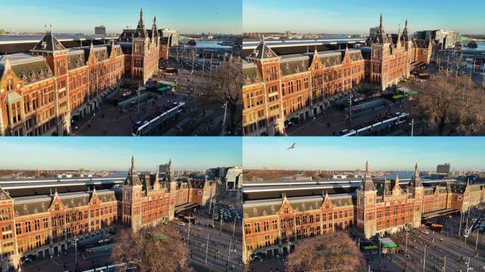 荷兰阿姆斯特丹著名景点鸟瞰图，日落时的阿姆斯特丹中央火车站、阿姆斯特丹中央火车站、阿姆斯特丹市中心和