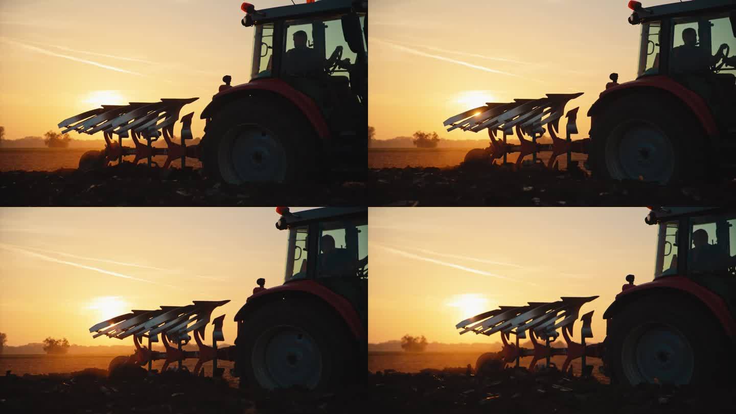SLO MO男性环保人士驾驶拖拉机在黄金时段对着天空耕作有机农场