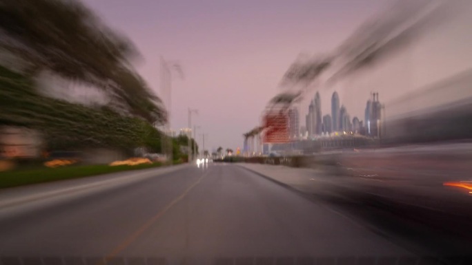 日落时间迪拜市著名的棕榈岛湾交通街道公路旅行前全景4k延时阿联酋