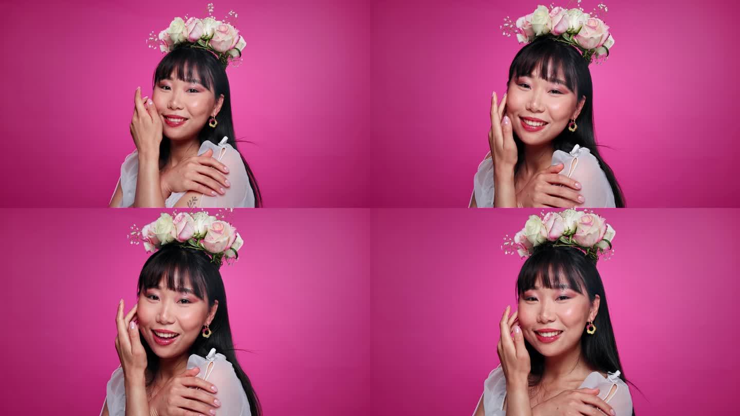 粉红色背景，美丽和日本女人与花冠健康，自信和护肤。沙龙，花卉美学和人物肖像自然的脸，快乐和化妆工作室
