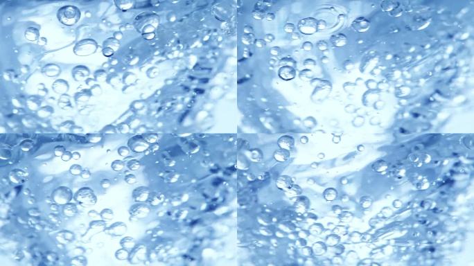 超级慢动作拍摄的油和水的蓝色漩涡在1000fps。