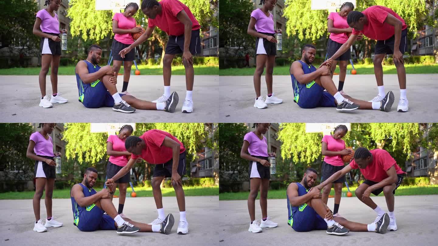 年轻的黑人男子在打篮球时腿部受伤，感到疼痛