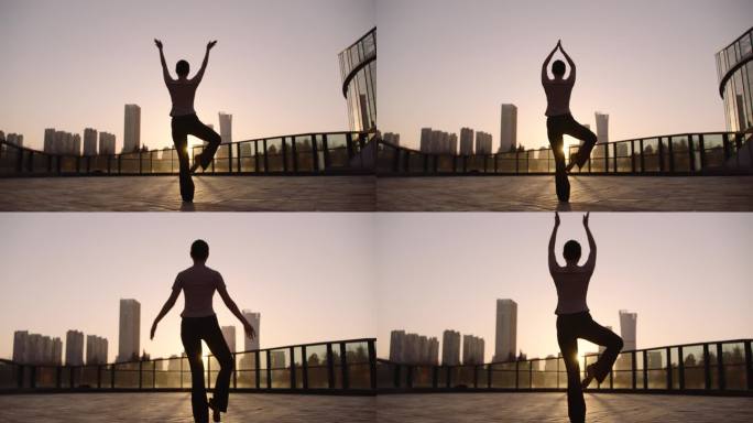 阿莱拍摄城市夕阳下女人做瑜伽健身运动放松