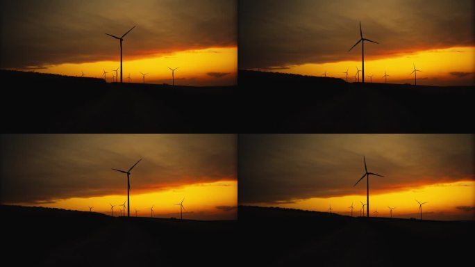 可持续发展的剪影:暴风雨黄昏天空下的风力涡轮机