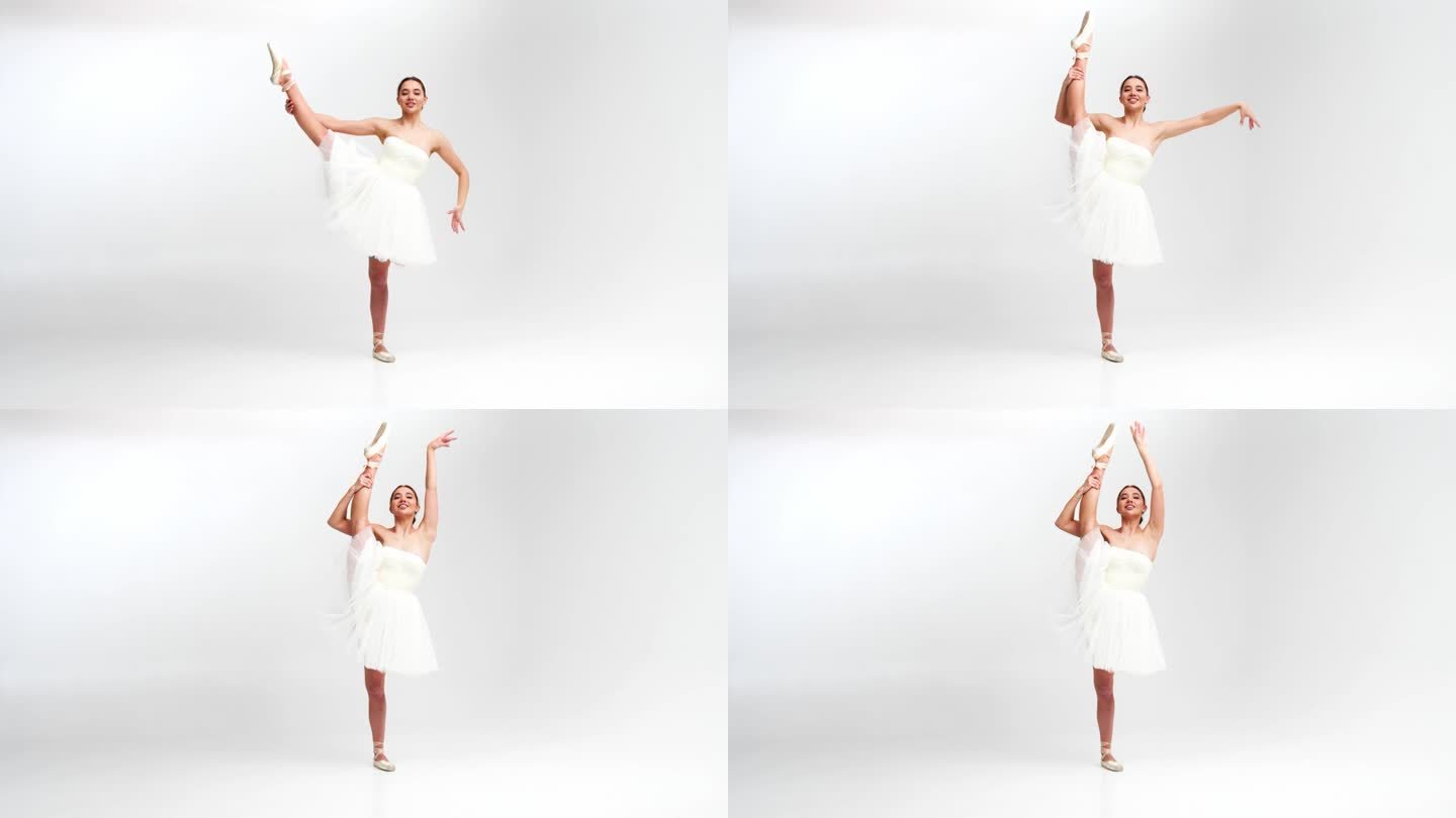 一位身穿白色芭蕾舞裙的专业芭蕾舞演员在一个大型训练大厅里跳舞。一个女孩穿着戏服跳舞。在一个宽敞的摄影