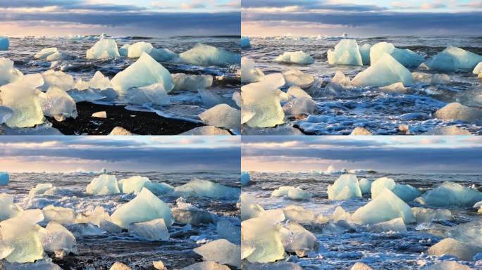 在黄金时段，冰山在黑色的海滩上闪耀，冰岛钻石海滩上的日出，受欢迎的旅游景点，清澈的冰被海浪撞碎，气候