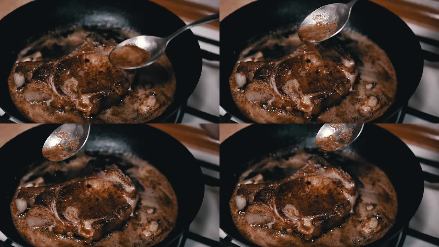 厨师将滚烫的油浇在多汁的煎肉上