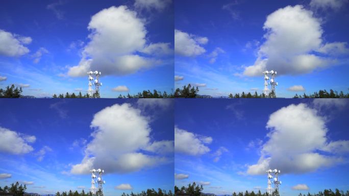 山顶有无线电塔，蓝天和云