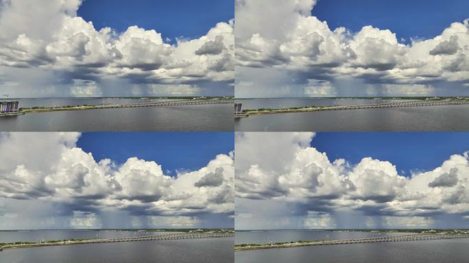 在和平河上连接蓬塔戈尔达和夏洛特港的交通桥上，雷暴前由海水蒸发的湿度形成的暴风雨云。恶劣天气不适合驾