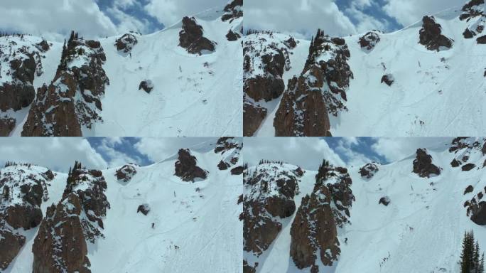 偏远地区的粉末滑雪板科罗拉多落基山脉的空气悬崖跳跃春天的雪泥新鲜的雪粉末空中电影无人机部分多云天气基