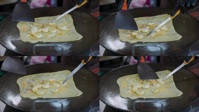 在泰国街头烹饪香蕉烤饼