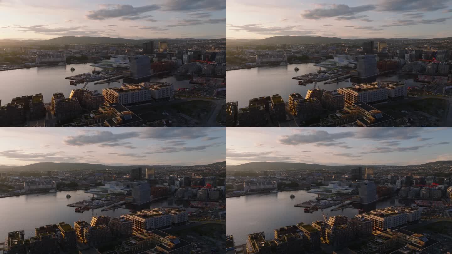 日落时分贝在城市的航拍幻灯片和全景镜头。挪威歌剧院和芭蕾舞团在海滨的未来主义建筑。首都的现代建筑。挪