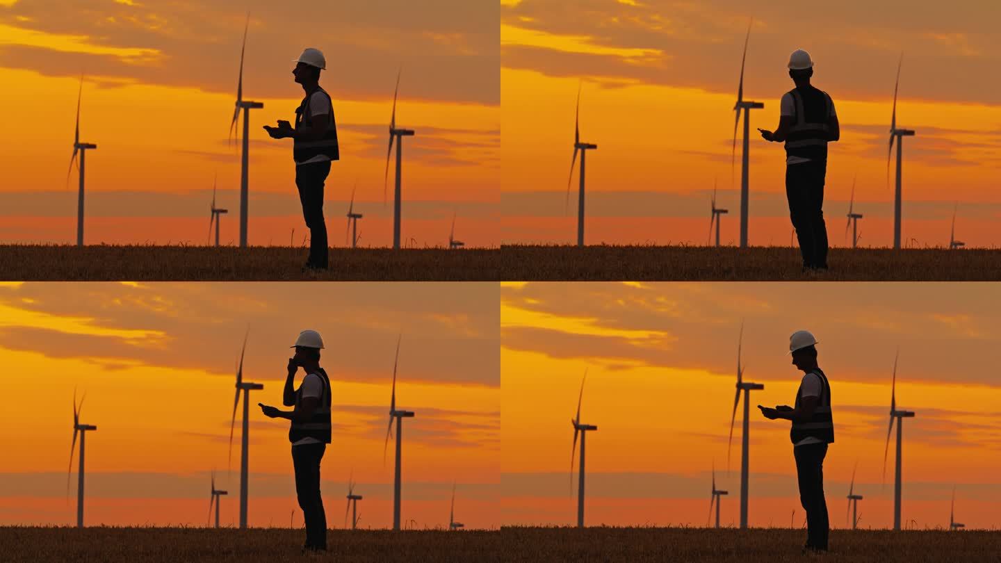 SLO MO暮光洞见:黄昏时利用现代技术的工程师剪影。清洁能源