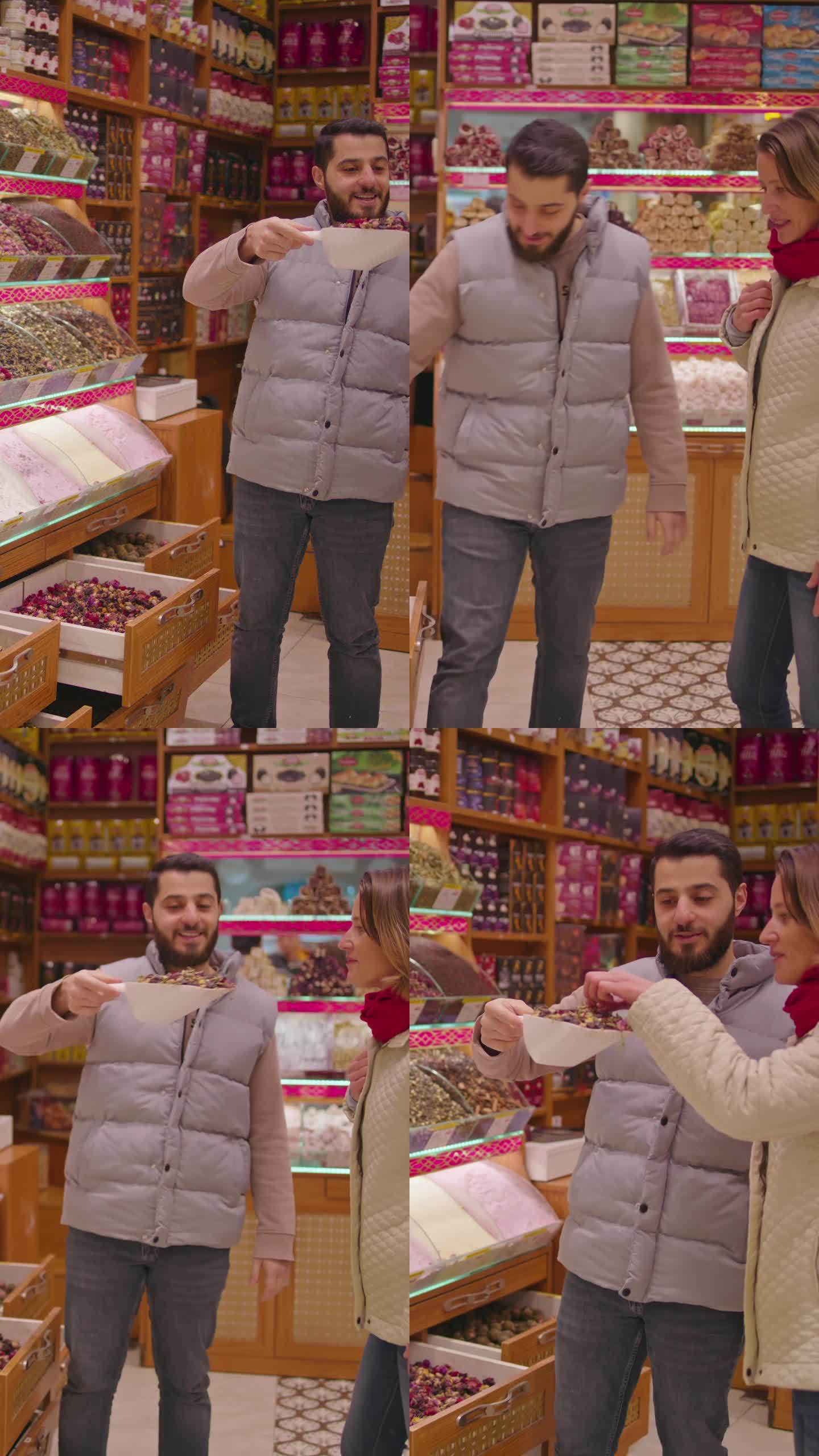 SLO MO香料展销会:土耳其小贩向高兴的女顾客介绍香料的芳香味道#SpiceMarketDisco
