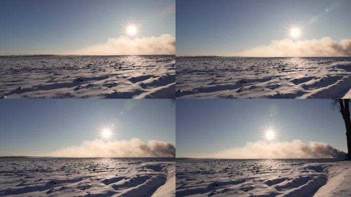 冬日雪野上的烟雾