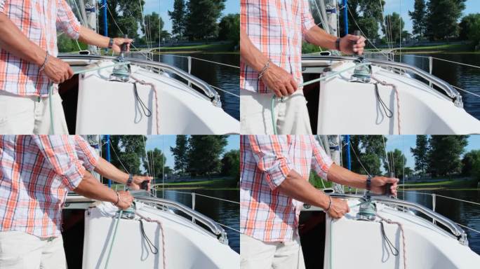 帆船运动员向船员展示如何使用手动绞车