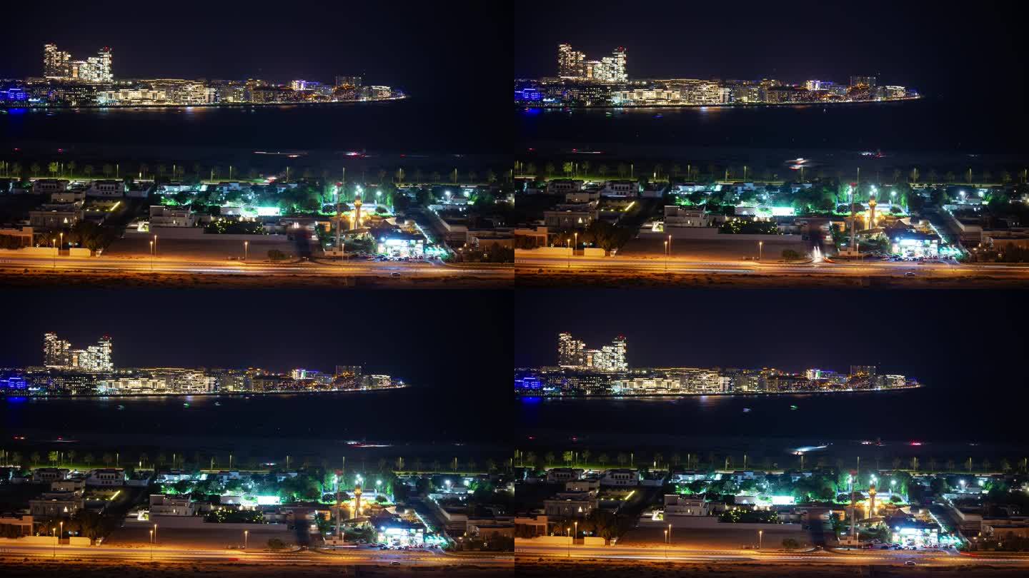 夜间照明迪拜市著名的棕榈岛新现代酒店海湾屋顶全景4k延时阿联酋