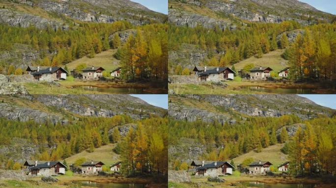 前多利高山纪念碑村勒莫纳萨瓦法国，木材和石头的房子，秋天的颜色，松树落叶松