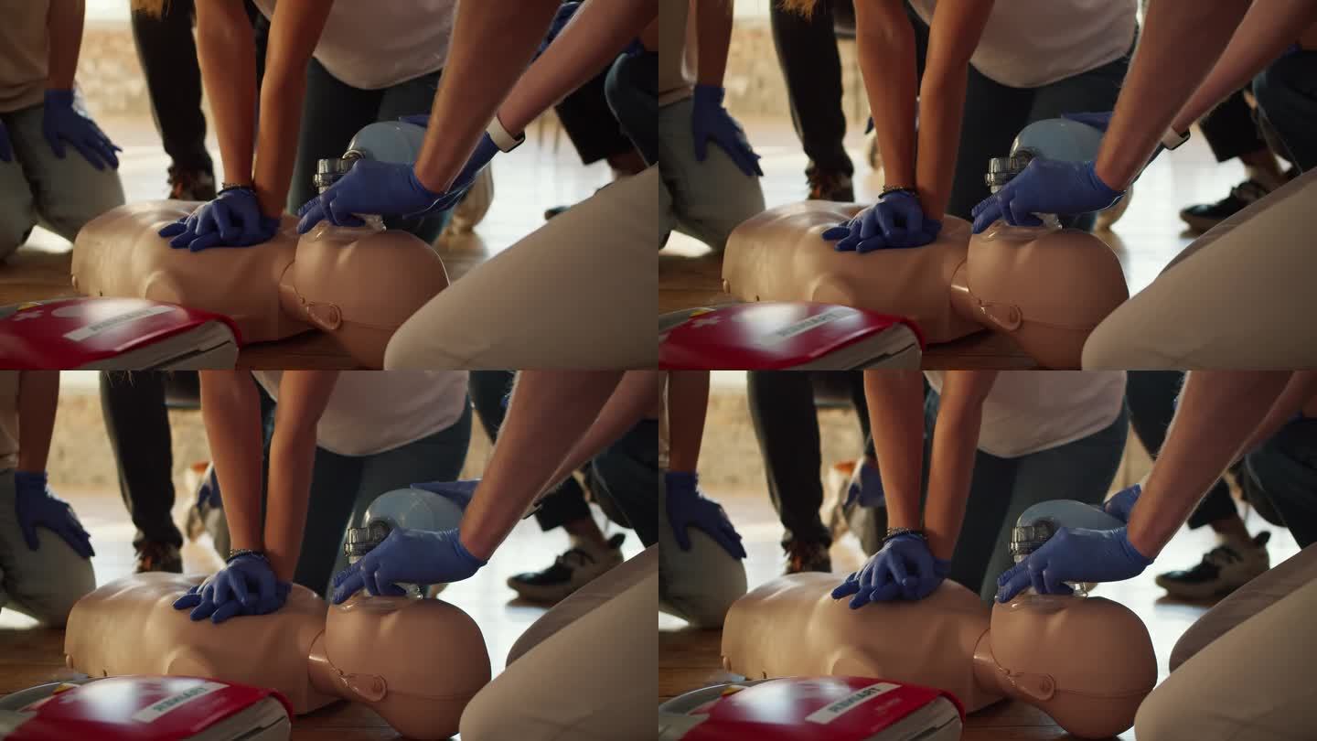 特写镜头:两个人在人体模型和急救袋的帮助下进行心肺复苏术。实际培训。急救培训