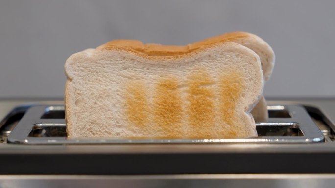 Closeup footage of the toast bread popping out of 