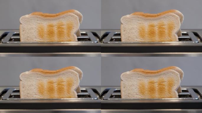 Closeup footage of the toast bread popping out of 