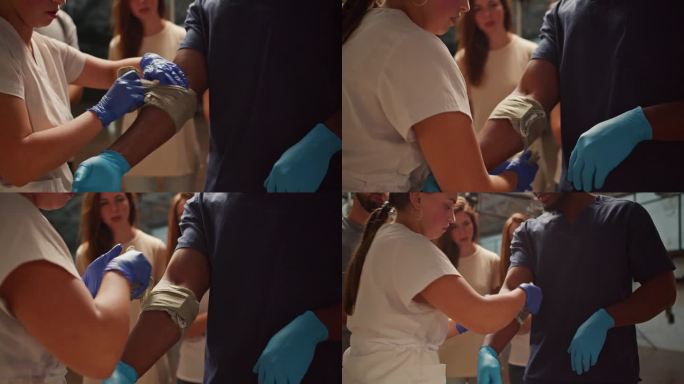 特写镜头:一名身穿白色医疗服的职业女护士在她的助手——一名身穿蓝色医疗服的黑人男子的手臂上缠上绷带。