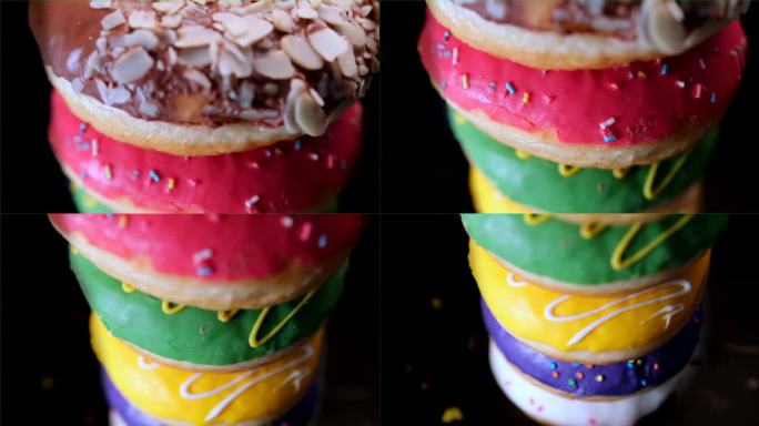 一个由不同口味的彩色甜甜圈组成的旋转塔