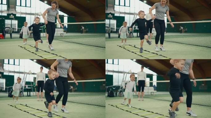 体育俱乐部网球场上女教练协助男孩进行敏捷阶梯训练